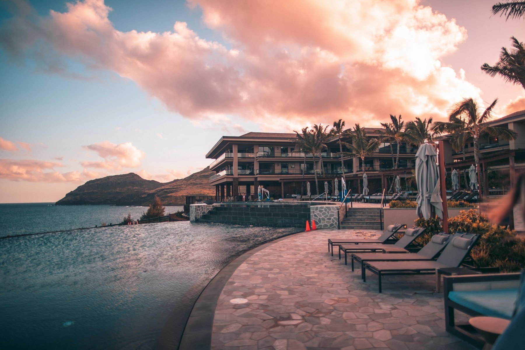 The SOLARA resort and infinity pool above the sea at golden hour